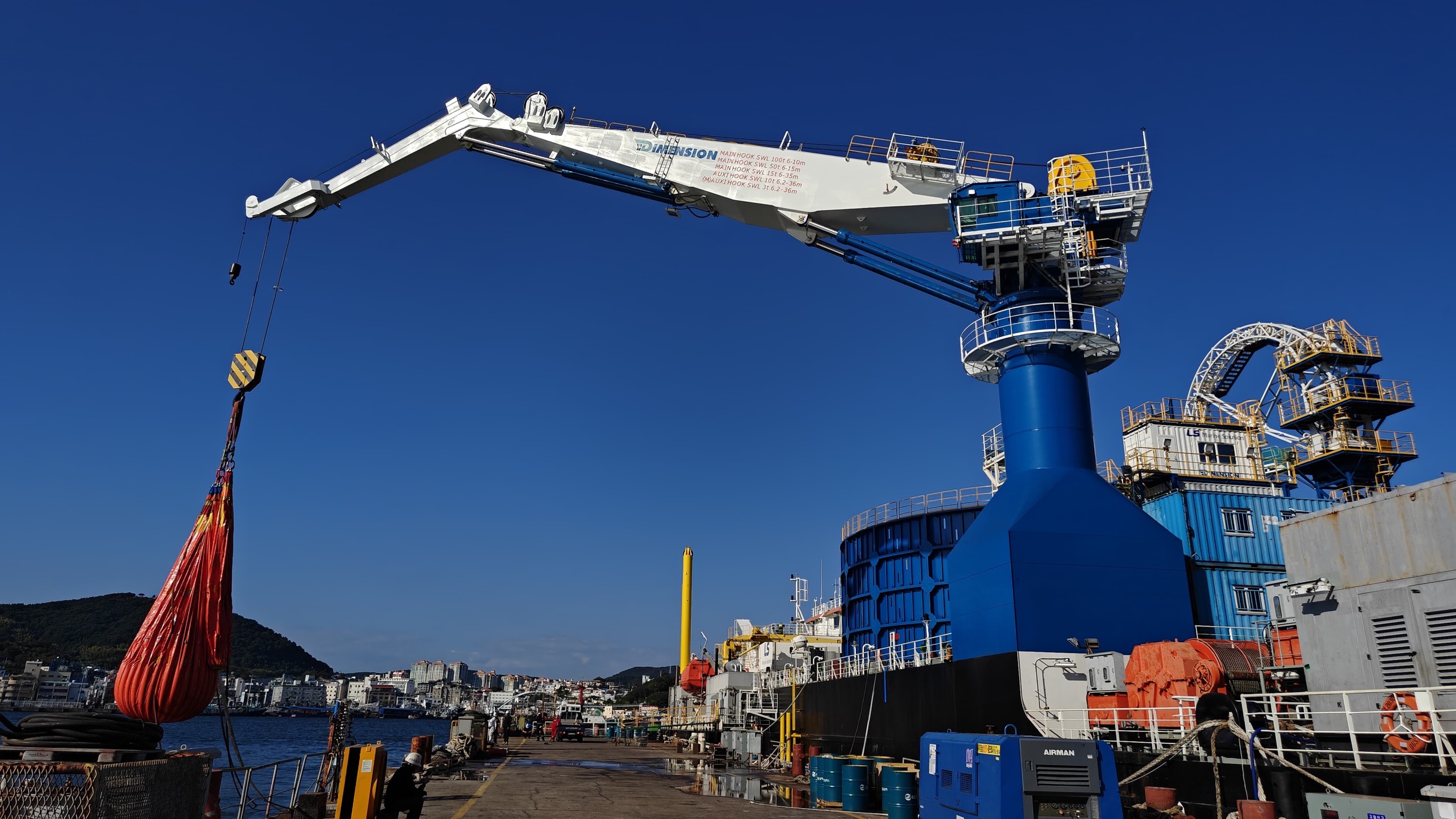 100 MT knuckle boom crane at full outreach during quayside load testing